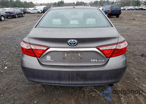2015 Toyota Camry Hybrid z USA, uszkodzony, nr VIN 4T1BD1FK5FU145950